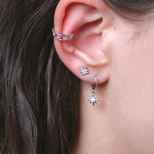 S925 sterling silver star stud earrings and ear cuff set worn on female model ear