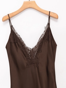 Close-up of deep brown satin camisole with delicate lace trim on the V-neckline