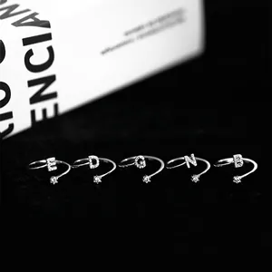 Luxurious adjustable silver ring featuring initial letters and sparkling zircon accents