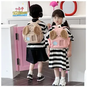 Detail of cute puppy ears and star patch on plush backpacks for boys and girls
