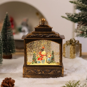 Detail of vintage bronze Christmas lantern with snowman scene and swirling glitter snow