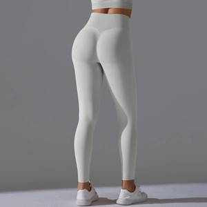 Detail view of high waist scrunch butt yoga pants in light grey with seamless texture