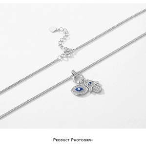 Detailed shot of S925 silver Hand of Fatima and Evil Eye pendant with lobster clasp