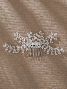 Detailed macro shot of bridal hair comb featuring silver wire and clear crystal beadwork