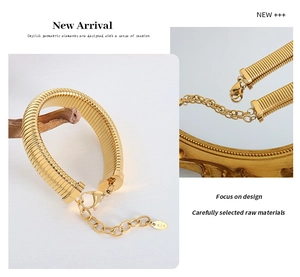 Macro detail of 18K gold plated herringbone chain with K18 stamp and lobster clasp