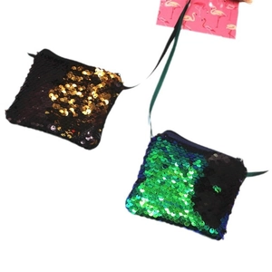 Kids sequin crossbody bag with reversible mermaid scale pattern in black and green