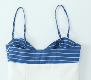 Detail of blue and white striped camisole top with thin straps and invisible side zipper
