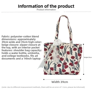Detail view of large floral cotton tote bag with white lace bow and dimensions 39x35cm