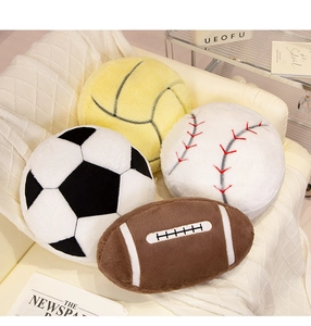 Detailed plush sports balls on a sofa including football, basketball, and baseball pillows