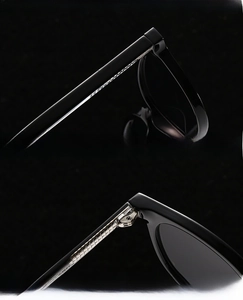 Detail view of reinforced black lenses and high-quality durable hinges on retro sunglasses