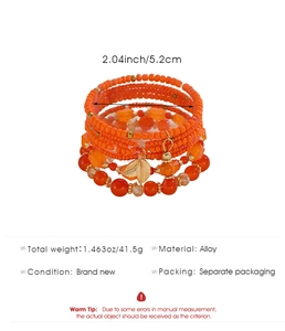 Detail view of orange multilayer beaded bracelet with gold leaf charm and specifications