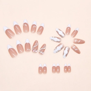 Detail of pink press-on nails featuring white French tips and silver snake scale art