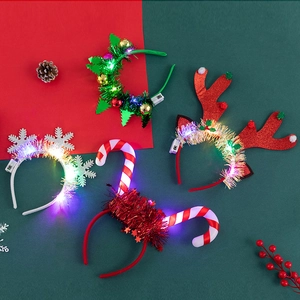 LED lighted Christmas headbands set featuring reindeer antlers and tree designs