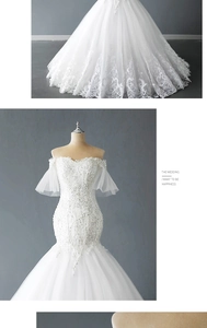 Detail of off-the-shoulder mermaid wedding dress with lace embroidery and sequins