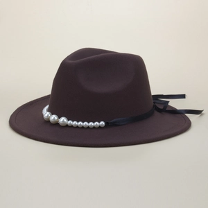 Detail of wool fedora hat with elegant pearl band and black ribbon bow decoration