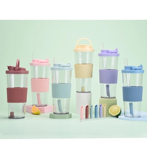 Set of colorful Tritan water cups with silicone sleeves and straws in six vibrant colors