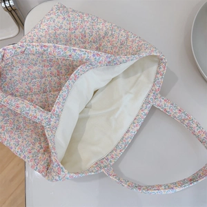 Top view of quilted floral tote bag showing spacious interior and soft cotton texture