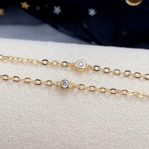 Minimalist gold-plated choker necklace with round zircon pendants on delicate O-chains
