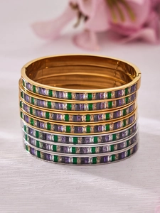 Detail of 18k gold plated stainless steel bangles with colorful rectangular zircons