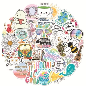 Close-up showing various VSCO stickers with cartoon animals and motivational phrases