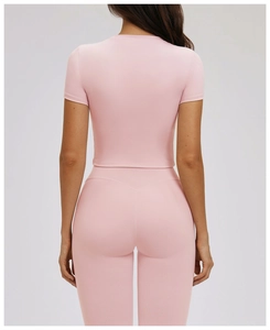 Rear view of pink tight yoga set showing slimming knit fabric and back fit details