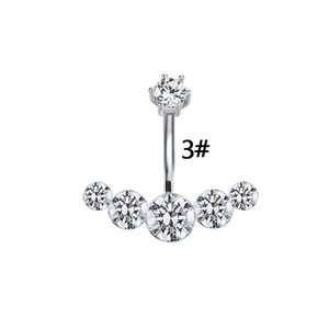 Silver curved belly button ring featuring a fan-shaped sparkling zircon cluster design