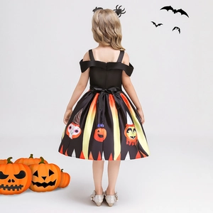 Detail view of Halloween pumpkin dress back with black bow and orange stripes