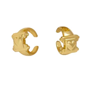 Minimalist double layer gold plated hoop earrings featuring a vintage heart relief pattern