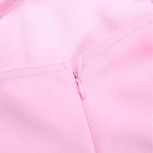 Close-up of the high-quality invisible zipper and fine stitching on the pink dress