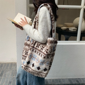 Close-up of fluffy winter tote bag with retro Nordic geometric pattern and soft texture