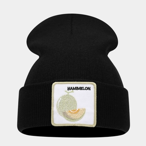 Close-up of the black knitted beanie with a rectangular Hami melon embroidery patch