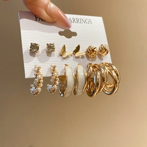 Detailed set of six gold-tone earrings with butterflies, pearls, and C-shaped hoops