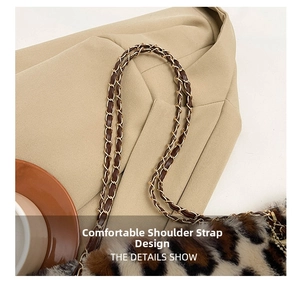 Detail of plush leopard print handbag with interwoven metal chain and leather shoulder strap