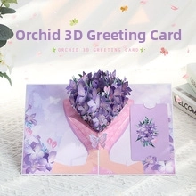 Detailed view of handmade 3D pop-up orchid greeting card with intricate purple floral layers