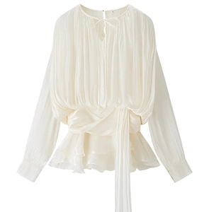 Detailed view of white long sleeve pleated chiffon dress with waist tie and lace-up neck