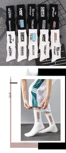 Detail of cotton athletic crew socks featuring street style embroidery and letter patterns