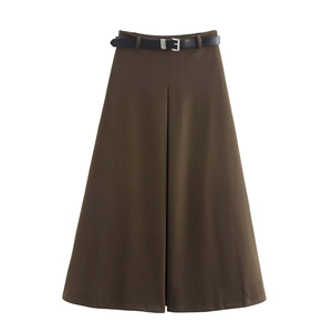 Detail shot of heavy brown wool skirt showing high waist design and black leather belt