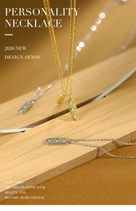 Macro view of gold and silver rectangle star zircon pendants on wood surface