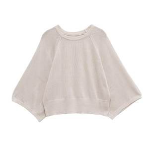 Oatmeal beige loose fit knit sweater with crew neck and wide sleeves on white background