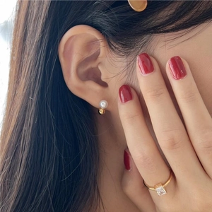 925 Sterling silver pearl stud earrings and gold square gem ring on female model
