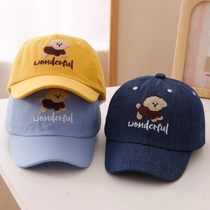 Close-up of adorable puppy embroidery and wonderful text on cotton baseball caps
