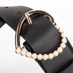 Black leather belt featuring a golden triangle buckle with inlaid pearl decorations