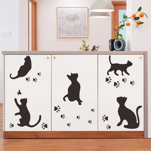 Playful black cat silhouettes and paw print wall decals for bedroom and home decoration