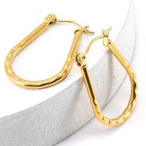 Detailed view of 18K gold plated hammered texture U-shape stainless steel earrings