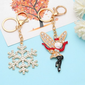 Christmas snowflake and fairy charm keychains with crystals and enamel finish