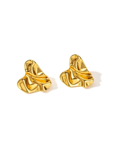 Close-up of golden irregular wrinkled stud earrings with textured metallic finish