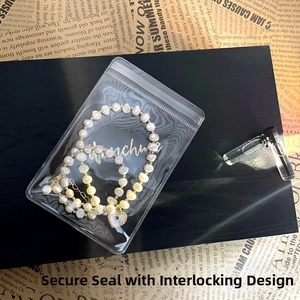 Irregular pearl necklace with heart pendant inside a clear dustproof sealing bag