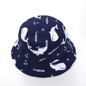 Detail of dark blue cotton bucket hat for children with white marine life pattern print