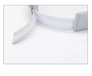 Detailed view of adjustable Velcro strap on the back of a light grey sports sun visor cap