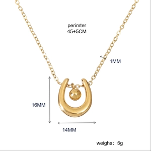 Detail view of gold U-shape pendant necklace with metal bead and size specifications